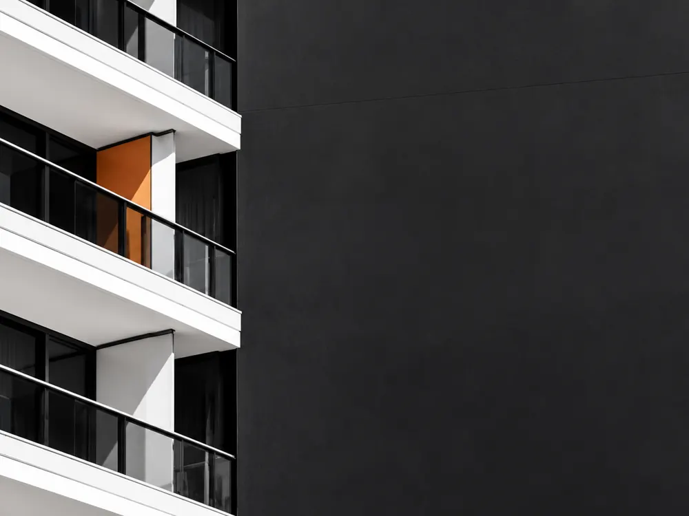 Apartment balconies with an orange accent